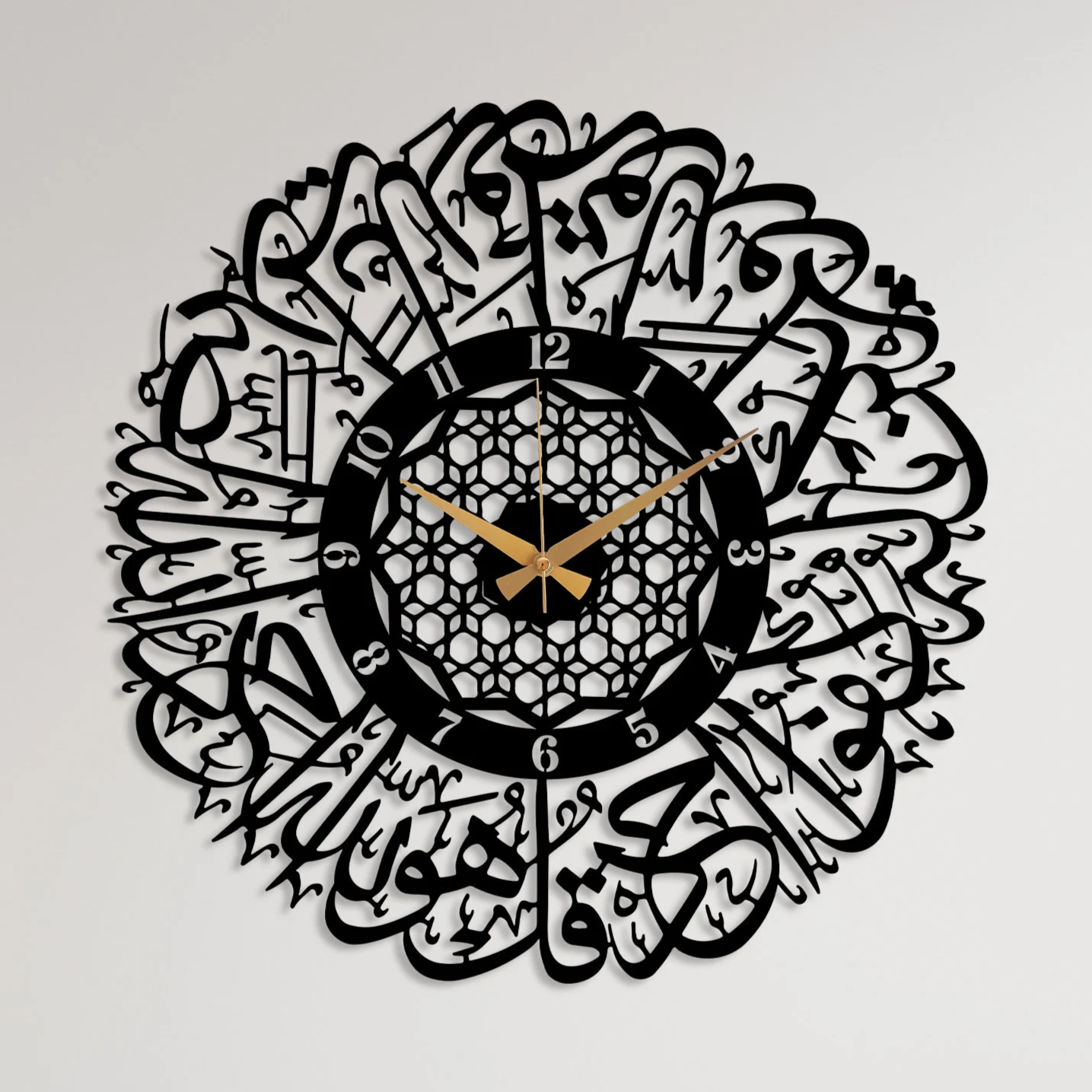 Decorative wall clock with Arabic calligraphy in a room with a chair, table, and bookshelf.